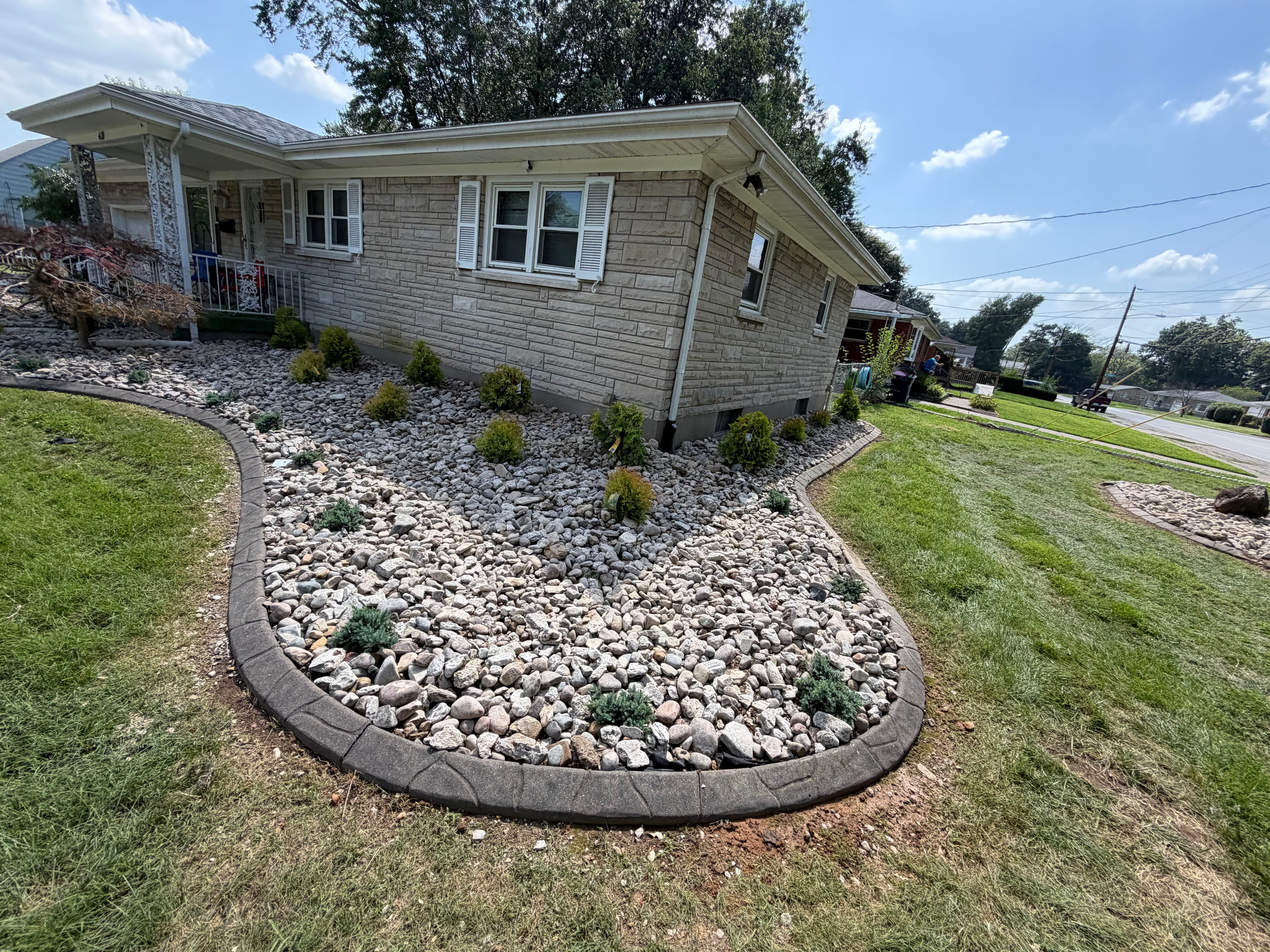 Project Full Front Yard Landscape Renovation with Rock Beds and Clean Edging image