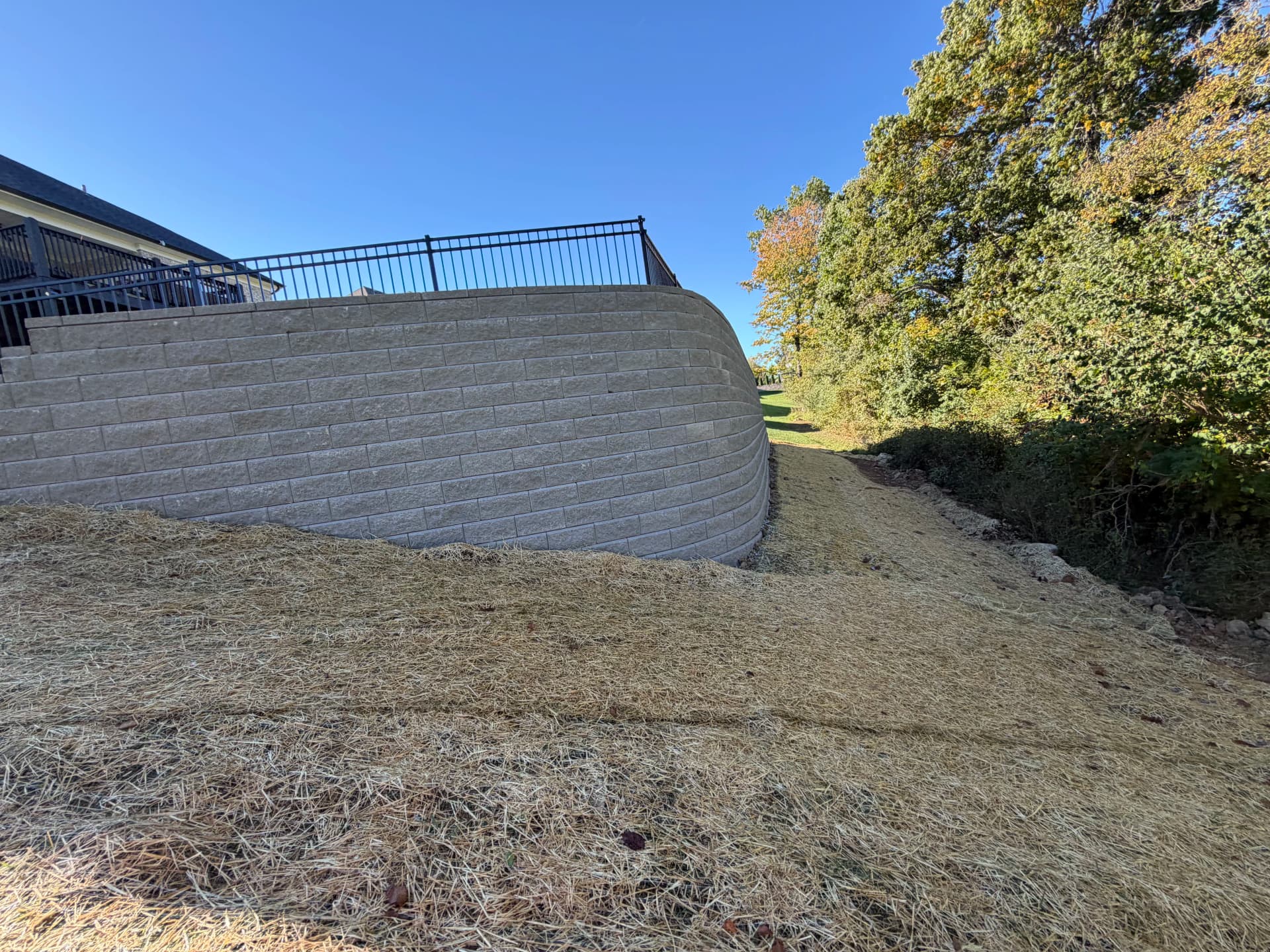 Gallery photos for Big Block Retaining Wall Turns a Sloped Backyard Into Usable Space: Image #1