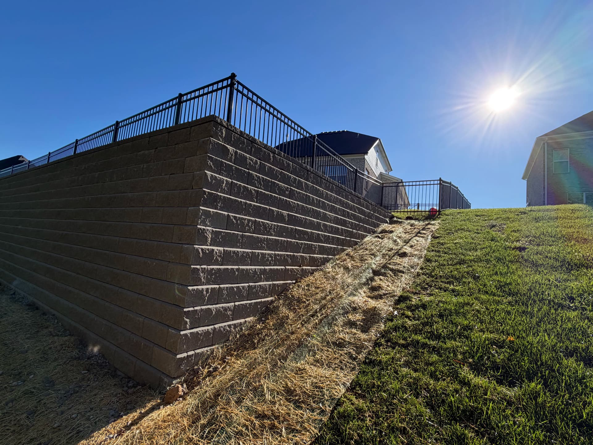 Gallery photos for Big Block Retaining Wall Turns a Sloped Backyard Into Usable Space: Image #2